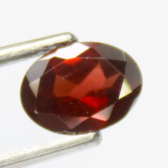 Faceted Red Mozambique Garnet: Oval Gemstone, 1.30 Carats