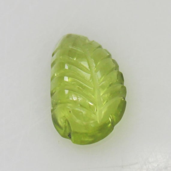 Natural Green Peridot Carving: 1.35 Carat Fancy-Shape Gemstone 9x6x3 mm Size