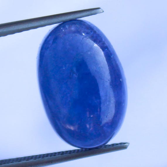 Natural Blue Tanzanite Cabochon: 9.40 Carat In Oval Shape Gemstone, 15x10x6 mm