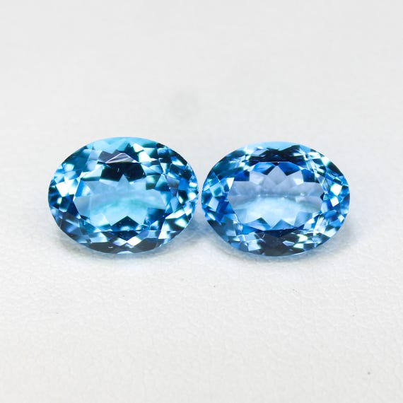 Natural Swiss Blue Topaz Gemstone Pair: Oval Cut, 6.30 Carat