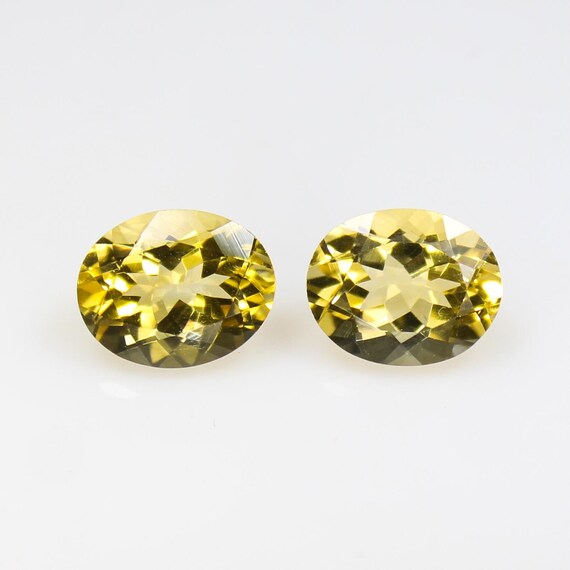 Natural Faceted Yellow Citrine Pair: Oval Gemstones, 5.60 Carats