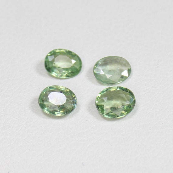 Faceted Green Sapphire Lot: Natural Oval Gemstones for Jewelry (1.40 Carats, 5x4x2 mm)