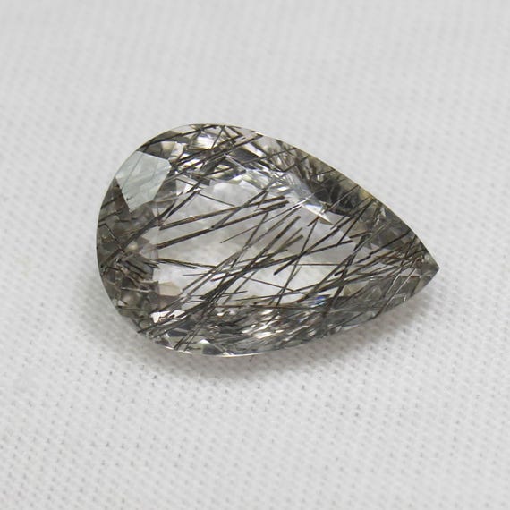 Faceted Black Rutile Quartz Pear: 6.35 Carat Gemstone