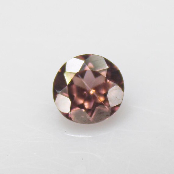 Faceted Brown Zircon: Round Gemstone, 1.15 Carats, 6x6x4 mm