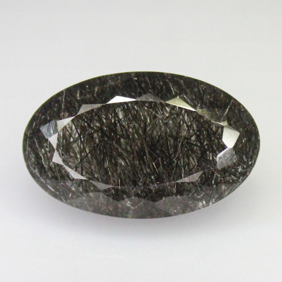 Natural Faceted Black Rutile Quartz: Oval Shape Gemstone (17.00 Carats, 22x13x9 mm)