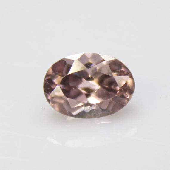 Faceted Brown Zircon: Oval Gemstone, 1.55 Carats, 7x5x4 mm