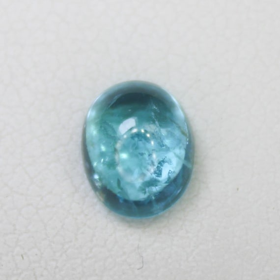 Natural Blue Apatite Cabochon: 1.60 Carat In Oval Shape Gemstone, 7x6x4 mm