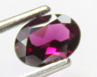Faceted Pink Rhodolite Garnet: Oval Gemstone, 1.70 Carats