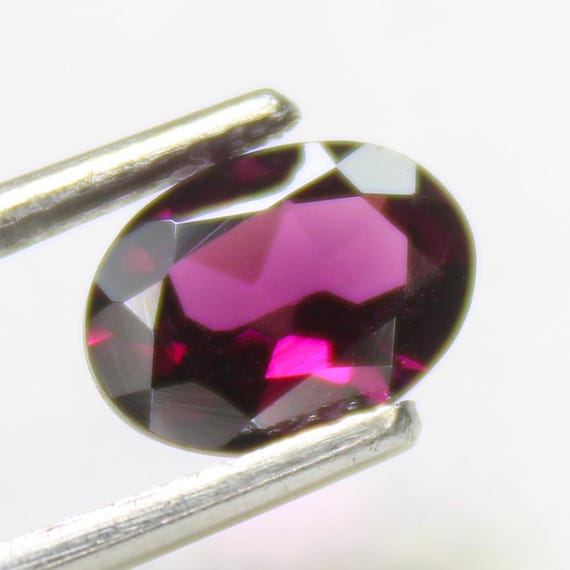 Faceted Pink Rhodolite Garnet: Oval Gemstone, 1.70 Carats