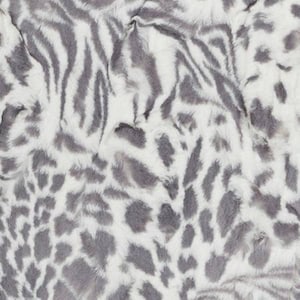 May include: A white and gray faux fur fabric with a zebra and leopard print pattern.