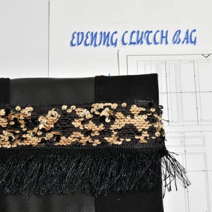 May include: Black evening clutch bag with a gold and black sequin trim and black fringe. The bag is made of a black fabric and has a simple design.