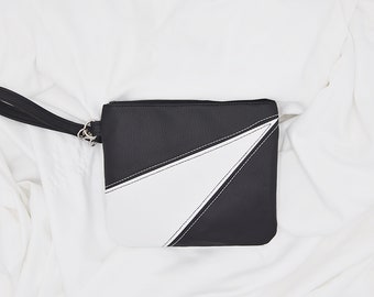 Black and white faux leather wristlet bag