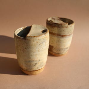 A Handmade Ceramic Travel Tumbler Gift for Coffee Lover with a beautiful artisan glaze and reusable design, this Handmade Pottery Gift Idea for Her also makes a meaningful Wedding Coffee Mug Gift for Fiancé or a useful College mug.