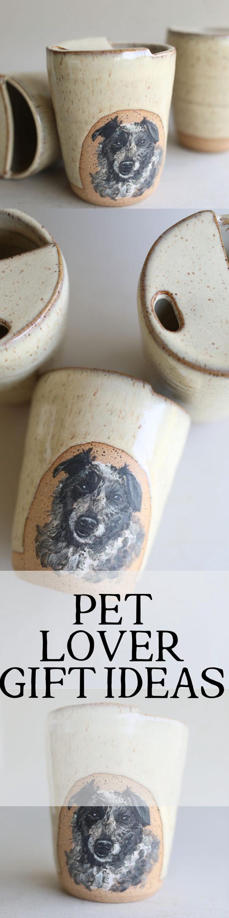 May include: Set of four ceramic mugs with a hand-painted dog portrait on each. The mugs are a light beige color with a brown rim. The text "PET LOVER GIFT IDEAS" is displayed below the mugs.