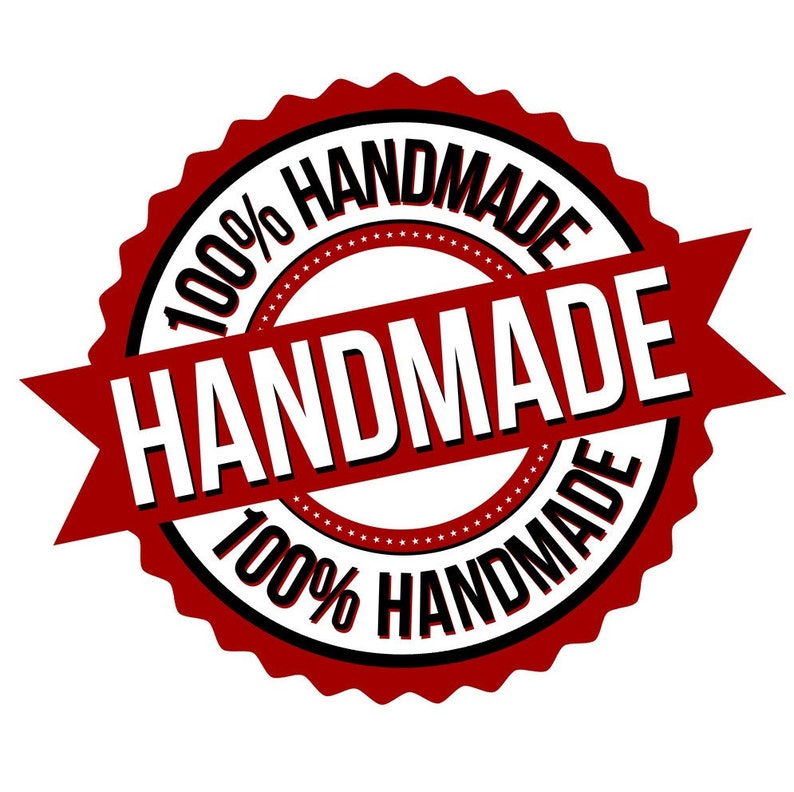 May include: Red and black circular stamp with the text "100% HANDMADE" and a red ribbon with the text "HANDMADE" across the center.