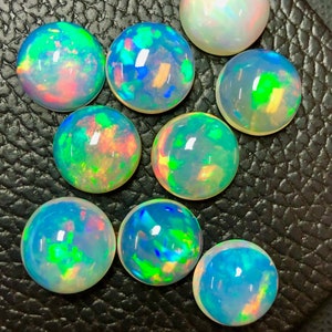 Opale rotondo AAA+++ Cabochon di opale etiope naturale di alta qualità lotto Welo Opal che realizza gioielli