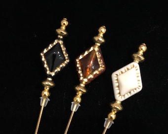 Black, amber or cream and gold hatpins in a choice of lengths