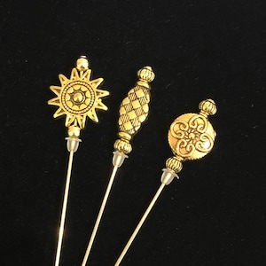 Antiqued Gold Tibetan style hat pins. A selection of 3 beautiful designs 15cm or 7.5cm long