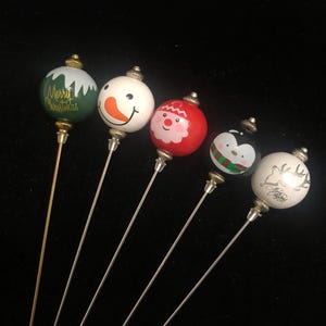 Novelty Christmas themed pins in a choice of designs and lengths - use as hatpins, lapel pins, stick pins decorations etc