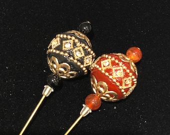 Decorative Indonesian style gold hat pins in black or red: 15cm long