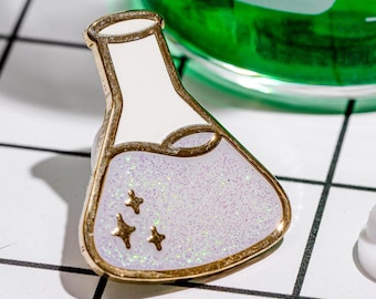 Winterglitterfles - wetenschap emaille pin