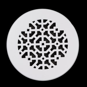 May include: White round drain cover with a geometric pattern of black circles and squares.