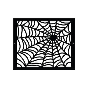 May include: Black metal cutout of a spider web design. The web is detailed and intricate, with a central point where the web radiates outward.