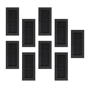 Puede incluir: Una colección de ocho cubiertas de ventilación rectangulares de metal negro. Cada ventilación tiene una serie de ranuras horizontales para el flujo de aire. Las ventilaciones están dispuestas sobre un fondo blanco.