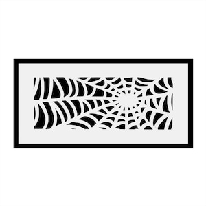 May include: Black and white spiderweb design in a rectangular frame. The design is a stylised spiderweb with a central point and radiating lines.