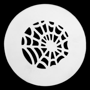May include: White round plastic vent cover with a spiderweb design cut out.