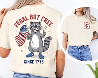 Feral But Free Raccoon Shirt | Funny 4th of July Tee | Patriotic Trash Panda Shirt | USA Raccoon Graphic Tee | Independence Day Humor