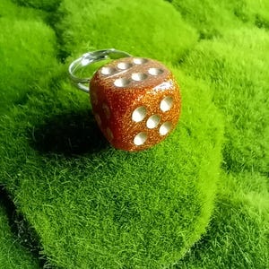 glittery orange dice ring,dnd,dungeons,dragons,dice game,gambling,casino,gambler,die,dice,game pieces,tabletop gaming,roleplaying games,