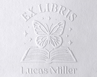 May include: White embossed design featuring the words "EX LIBRIS" above a butterfly and an open book. The name "Lucas Miller" is below the book. Four star shapes are also included in the design.