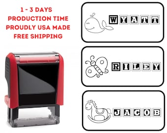 May include: Red self-inking stamp with a clear window showing the ink pad. The stamp features three different designs with names spelled out in blocks: Wyatt, Riley, and Jacob. Each design includes a cute illustration: a whale, a butterfly, and a rocking horse.