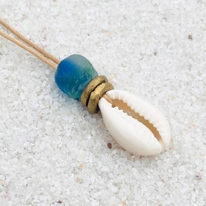 Cowrie shell necklace blue green sea glass beads and brass rings on satin cord for women. Sea shell necklace pendant gift for her