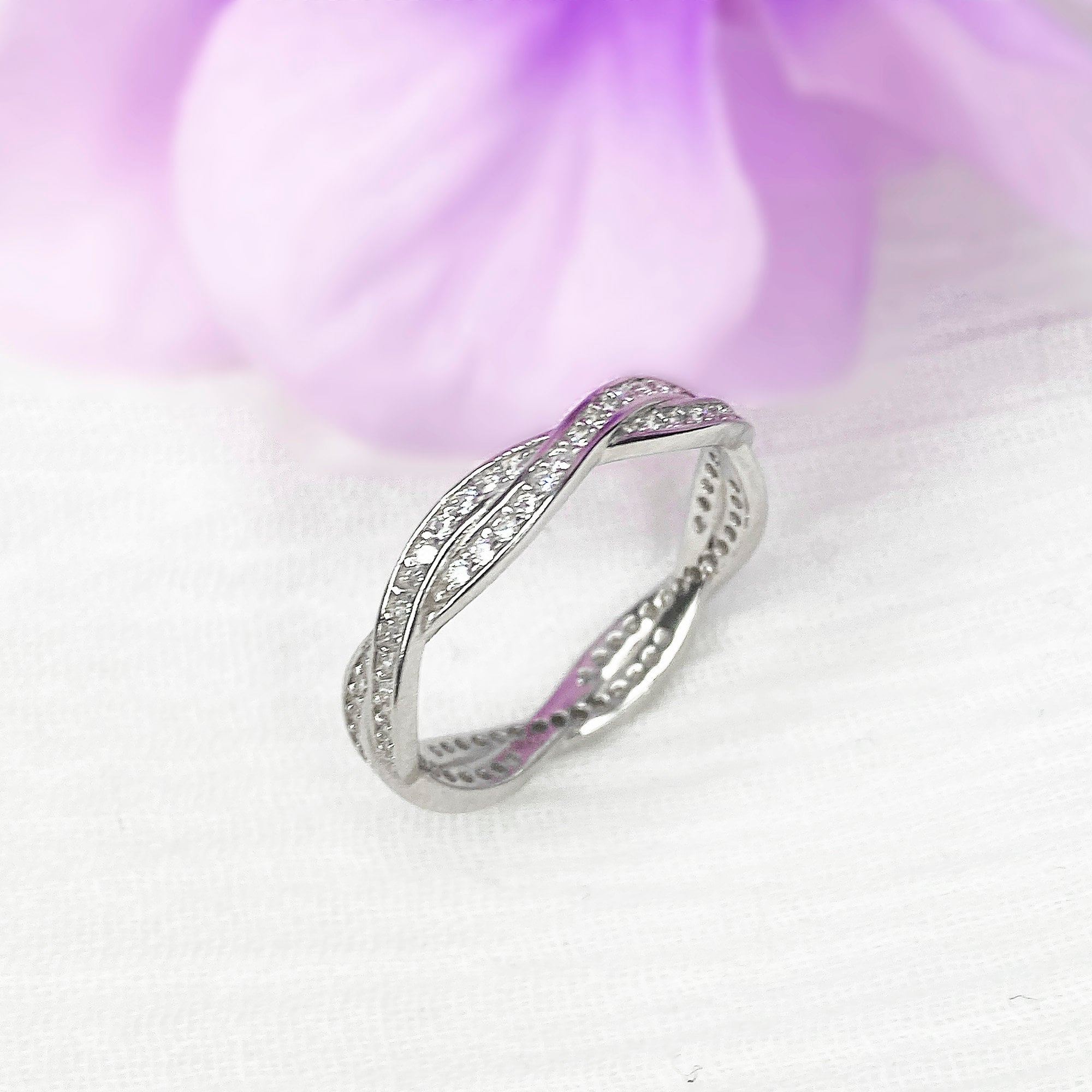 Braided diamond wedding band deals