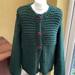 Super chunky hand knitted jacket/cardigan. Wool mix.bottle green. Size 10/12
