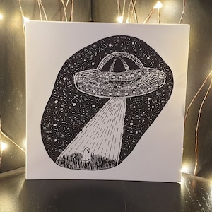 Postal "Fantasma en el OVNI"