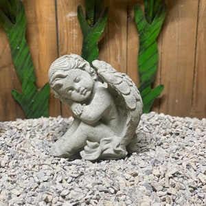 Sideways angel concrete statue garden decor