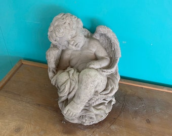 Angel in basket concrete statue