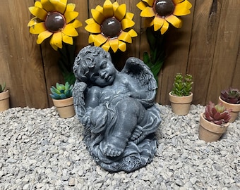 Painted Angel in basket concrete statue