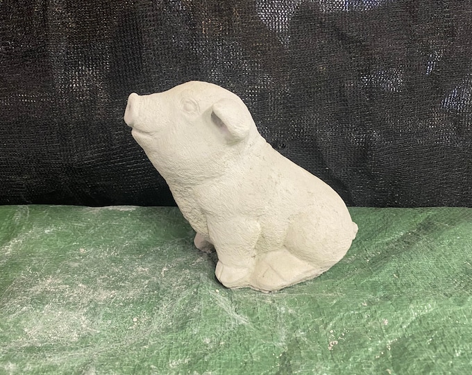 Sitting pig concrete statue
