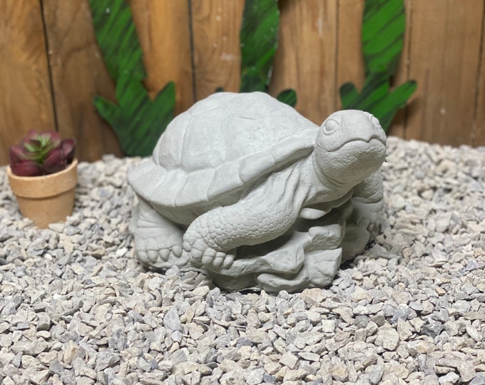 Large turtle on rock concrete statue