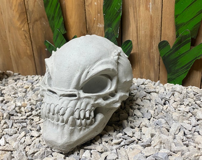 Alien skull concrete statue