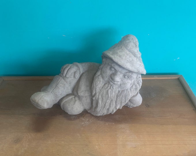 Laying garden gnome concrete statue