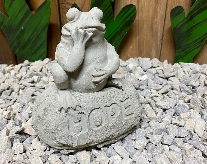 Frog on hole rock concrete statue