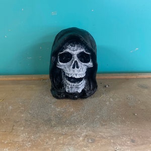 Small painted grim reaper head concrete statue