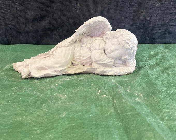 Laying girl angel concrete statue
