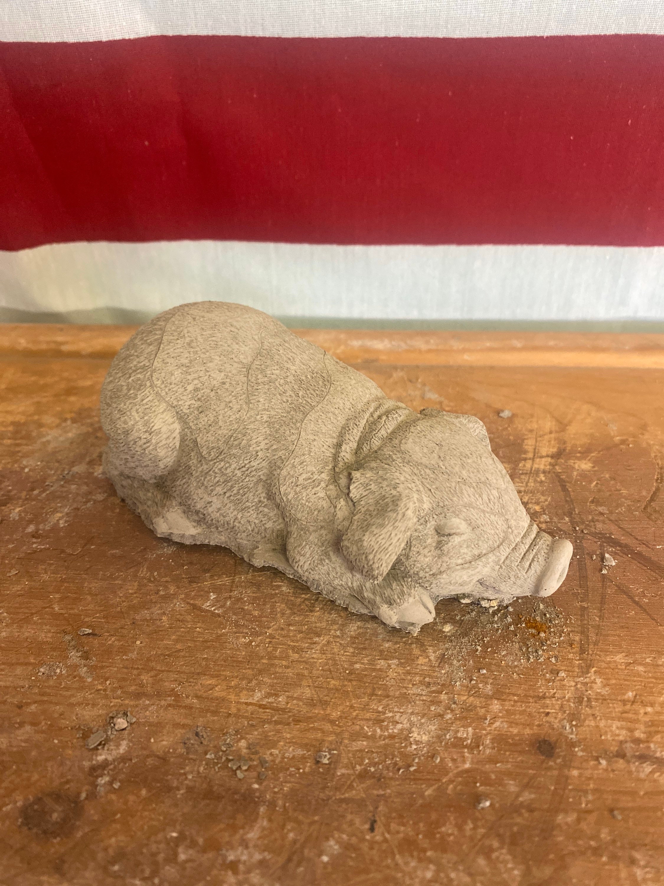 Small pig concrete statue