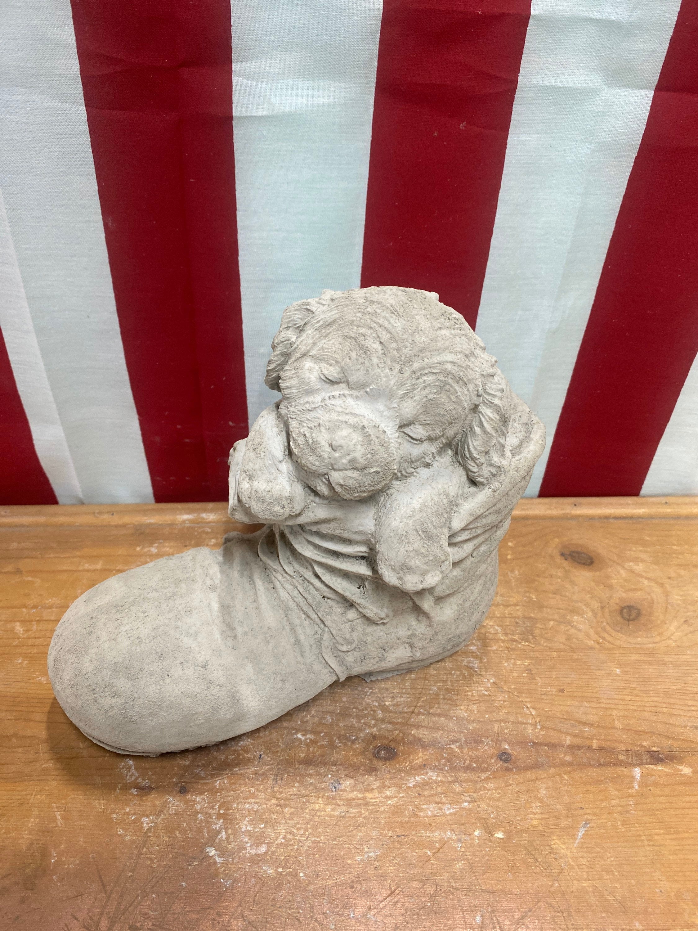 Dog puppy in boot Concrete statue